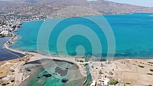 Old mills in Elounda, Crete from above. Panoramic view with drone photo