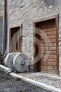Old millstone in Guardia, rural town in Trentino Alto Adige, Italy photo