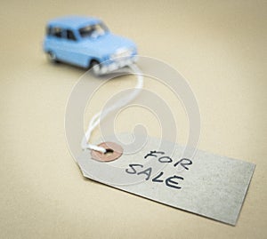 Old miniature car with marked label for sale