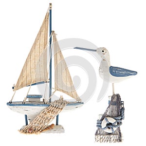 Old miniature sailboat and sea gull