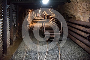 Old mining carts with wheels on rail for the transportation of minerals, Harachov