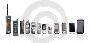 Old Mobile Phones from past to present on white background. photo