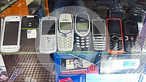Old mobile phones in a second hand shop