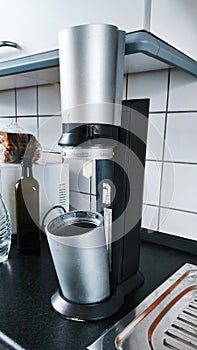 old model soda water carbonation machine placed in modern kitchen interior today