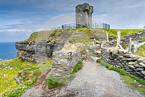 Old Moher Tower on Hags Head, watchtower at Cliffs of Moher, Ireland photo