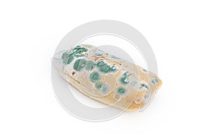 Old moldy bread on white background