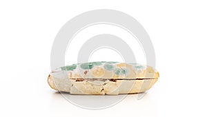 Old moldy bread on white background