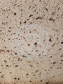 Old moldy with small holes in the stone. Grunge background photo