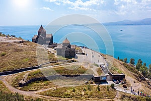 Old monastery on background of lake Sevan