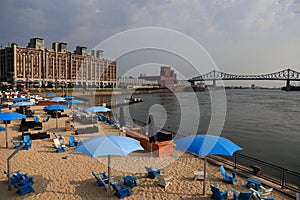 Old Montreal`s beach, buildings, St. Lawrence River and Jacques Cartier bridge