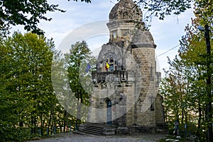 An old monument on the way to the Magura Ocnei monastery, Bacau, Romania