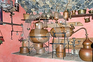 Old moonshine still stands in a cellar with pink walls