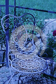 Old more rusty, more romantically, chair from metal,