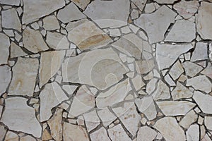 Old Mosaic wall of beige blocks of Jerusalem stone texture