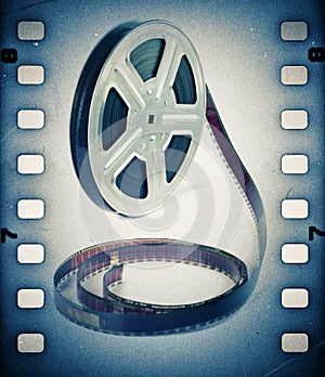 Old motion picture film reel with film strip.