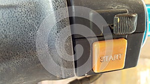 Old motorcycle engine start button