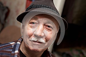 Old moustached man in hat photo