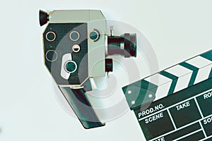 Old movie camera and clapperboard