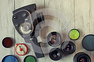 Old movie camera and several lenses