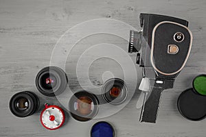 Old movie camera and several lenses