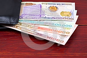 Old Mozambican money in the black wallet