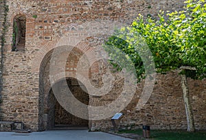 Old Mudejar style arch door in the medieval walls of the town of Buitrago de Lozoya, Spain