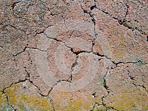 Old mudwall with many cracks.