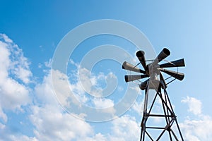 Old multidirectional emergency siren attached to a steel pylon