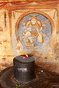 Old mural of the god nataraja with lingha statue on a wall in the ancient Brihadisvara Temple in Thanjavur, india.