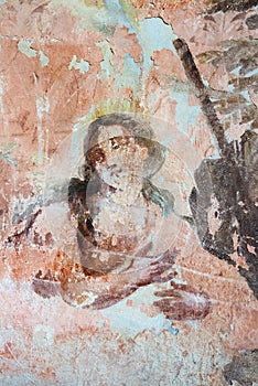 Old mural painting in the ruins of the church