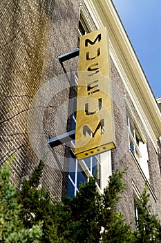 Old museum metal outdoor sign