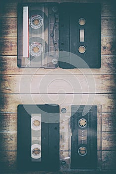 Old cassette tapes with a wooden background photo
