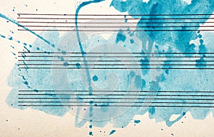 Old music sheet in blue watercolor paint. Blues music concept. Abstract blue watercolor background.