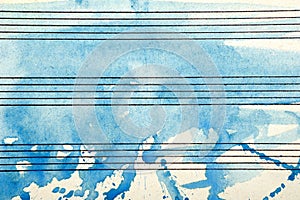 Old music sheet in blue watercolor paint. Blues music concept. Abstract blue watercolor background.