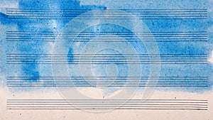 Old music sheet in blue watercolor paint. Blues music concept. Abstract blue watercolor background.