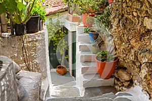 Old narrow scenic street in Anafiotika, Plaka district, Athens, Greece