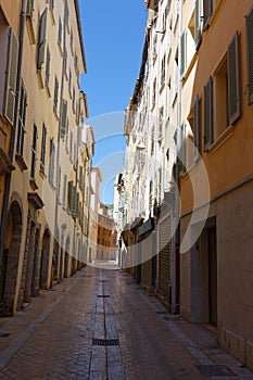 Old Narrow street and apartment buildings in Toulon, Riviera, Cote d`Azur