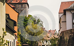 Old narrow streets of the medieval old Czech town of Cesky Krumlov and the red roofs of the houses