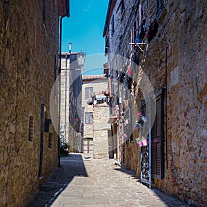 The old narrow streets in the medieval town of Casale Marittimo in Tuscany shot with analogue film technique photo