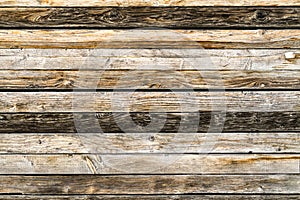 Old natural brown barn wood wall. Wooden textured background pattern.