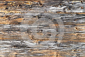 Old natural brown cabin wood wall. Wooden textured background pattern.