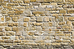 Old natural stone wall, background, texture or pattern. Rustic texture. Wall with bricks of italian stones
