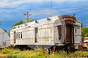 An old neglected rail car sitting by itself showing the wear of time