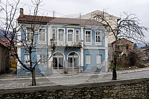 Old neoclassical building by the river in Florina, Greece