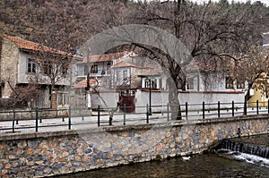 Old neoclassical buildings by the river in Florina, Greece