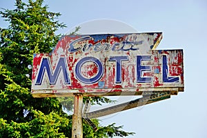 Old Neon Painted Motel Sign with Arrow on Tall Metal Pole