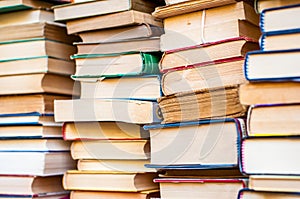 Books stacked. Piles of books background.