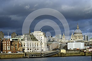 Old and new buildings against blue sky in uk