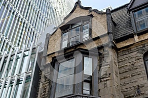 Old and new houses with huge windows