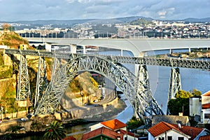 Old and new railway bridges over Douro river in Oporto